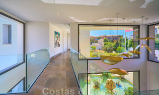 Una obra maestra única, villa de lujo moderna con impresionantes vistas al mar a la venta, en primera línea de golf en un resort de primera clase, Benahavis - Marbella 36705 