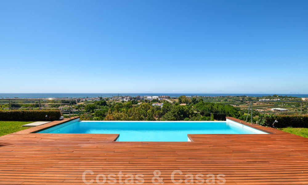 Moderna villa con vistas panorámicas al golf y al mar en venta en Los Flamingos Golf en Marbella - Benahavis 26062