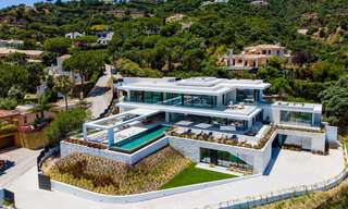 Se vende sensacional villa de lujo nueva y moderna con vistas al mar en la urbanización cerrada El Madroñal en la zona de Marbella - Benahavis 35912 