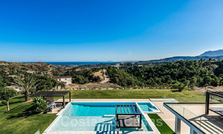 Villa de diseño en venta con vistas panorámicas al mar en un prestigioso complejo de golf en Benahavis - Marbella 40954 