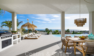 Exclusiva villa de diseño con vistas panorámicas al mar en venta en un resort de golf de cinco estrellas en Marbella - Benahavis 48850 