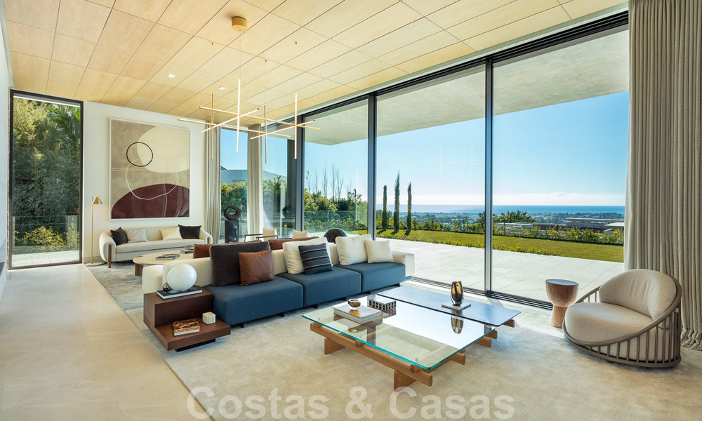 Villa de diseño arquitectónico lista para entrar a vivir en venta con vistas abiertas al mar en una prestigiosa zona residencial cerrada en las colinas de La Quinta en Benahavis - Marbella 49253