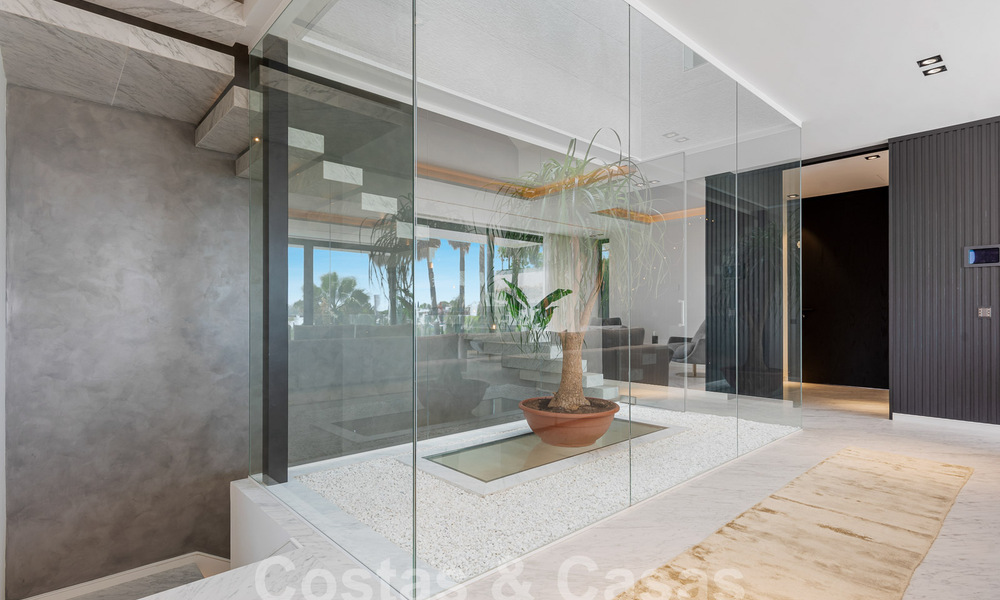 Nueva villa de diseño modernista en venta con impresionantes vistas al mar en prestigioso resort de golf en Marbella - Benahavis 55863