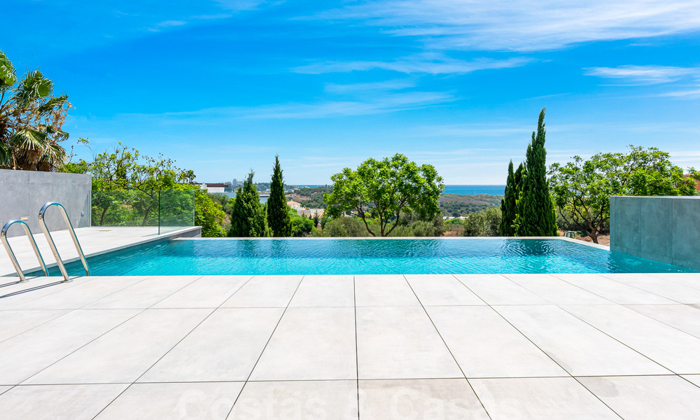 Nueva villa de diseño modernista en venta con impresionantes vistas al mar en prestigioso resort de golf en Marbella - Benahavis 55892