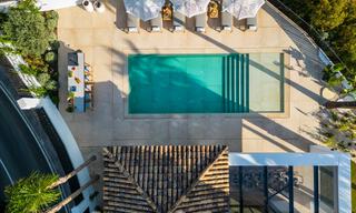 Moderna villa andaluza de lujo con vistas despejadas al mar en venta en urbanización cerrada de La Quinta, Marbella - Benahavis 59528 