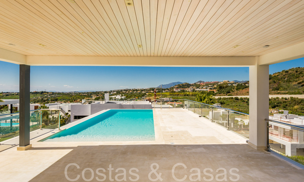 Nueva villa con estilo arquitectónico moderno en venta en el valle del golf de Nueva Andalucía, Marbella 65911