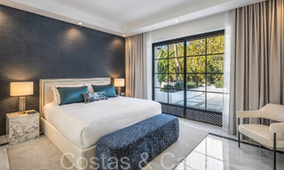 Villa magistral con estilo arquitectónico morisco-andaluz en venta, rodeada de campos de golf en el valle del golf de Nueva Andalucía, Marbella 67101 