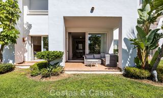 Apartamento con jardín en venta en un complejo exclusivo cerca de una gran laguna azul en la Costa del Sol 777429 