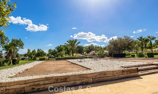 Apartamento con jardín en venta en un complejo exclusivo cerca de una gran laguna azul en la Costa del Sol 777444 