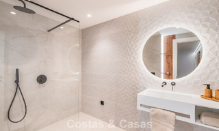 Apartamento de lujo de 4 dormitorios en venta en un complejo cerrado en el campo de golf en Nueva Andalucía, Marbella 780346 