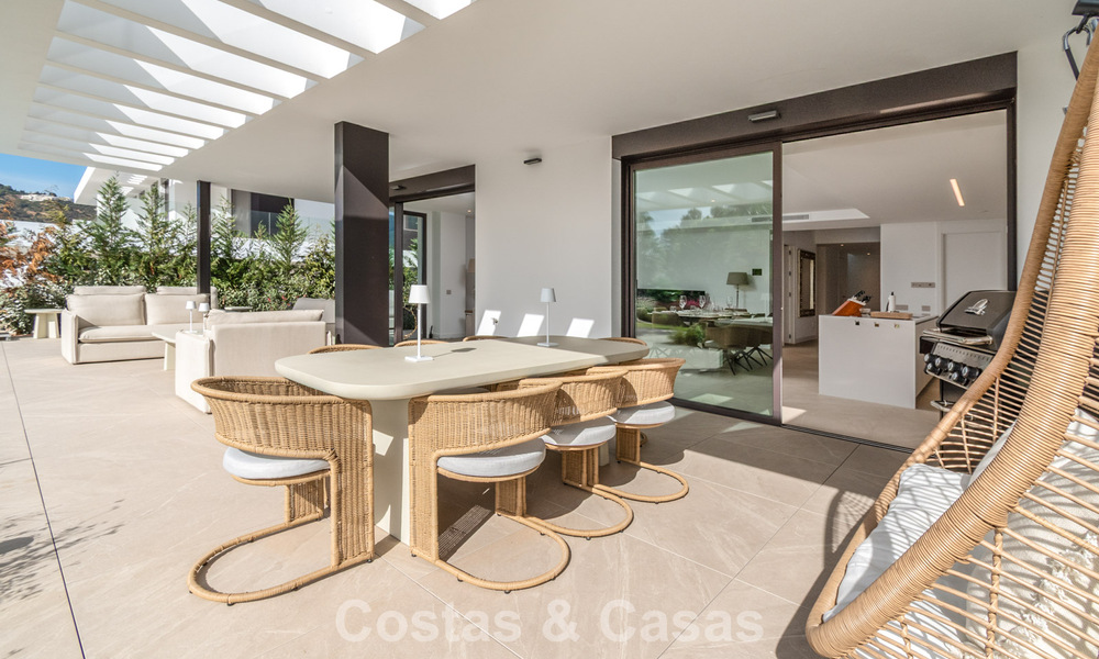 Moderna casa adosada en venta en un complejo de golf al este del centro de Marbella 787936