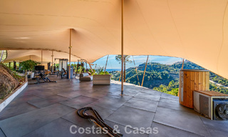 Villa arquitectónica moderna con vistas al mar y un gimnasio profesional en venta en El Madroñal, Benahavís - Marbella 793726 