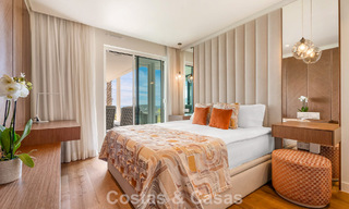 Moderno apartamento con jardín en venta con vistas panorámicas a la costa en un exclusivo complejo cerca de Marbella ciudad 794496 